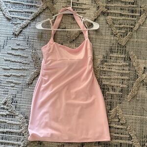 Tight fitting RUNAWAY brand dress light pink. (Small stain)